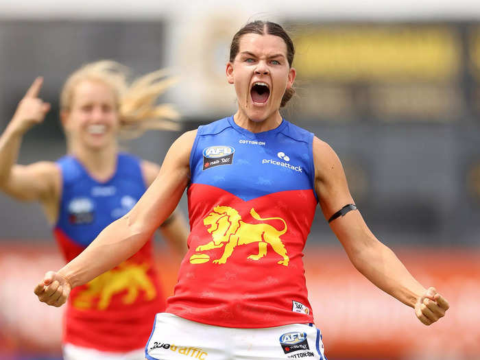 2/13: Sophie Conway of the Brisbane Lions celebrates after scoring a goal during an AFLW match against the St Kilda Saints in Melbourne, Australia.