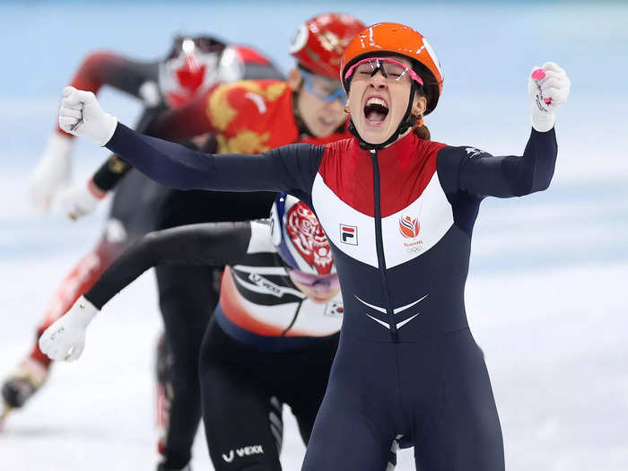 2/13: Suzanne Schulting of Team Netherlands celebrates winning the gold medal and setting a new Olympic Record time of 4:03.40 during the Women