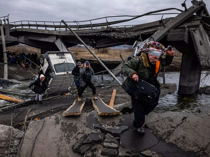 A railway bridge in Irpin has become a site of destruction and death under Russia