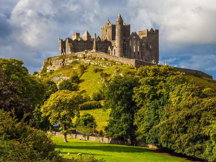 The Rock of Cashel is a historic monument set on a lush, scenic hilltop in County Tipperary.