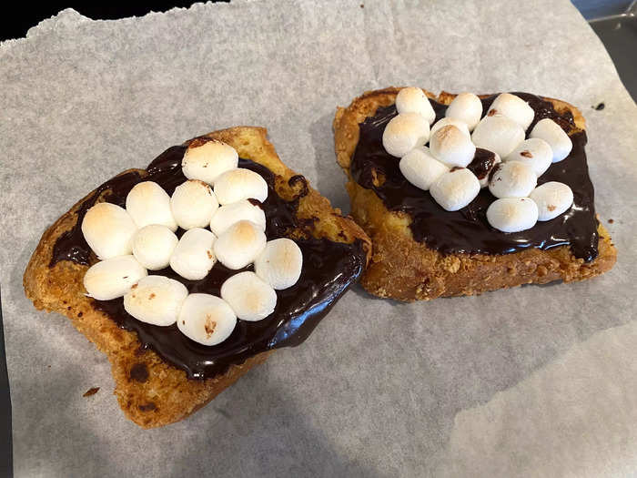 When the slices were golden brown, I placed them on a baking sheet and coated each with chocolate and marshmallows.