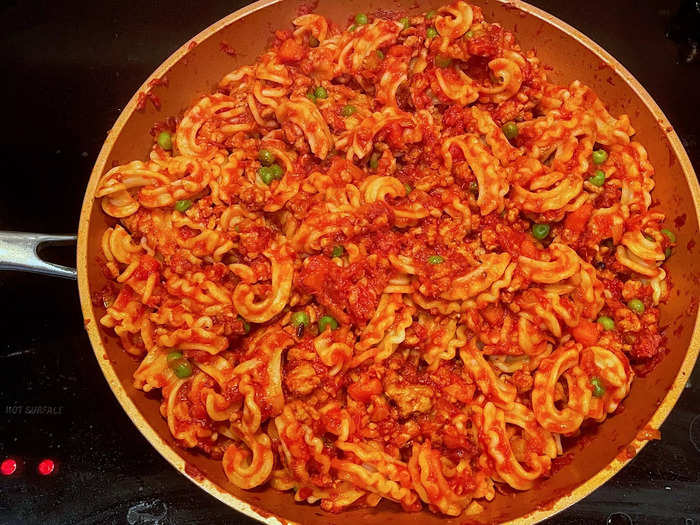 I stirred my cascatelli into the ragu, making sure to coat everything evenly. My pasta was ready, and it looked beautiful.