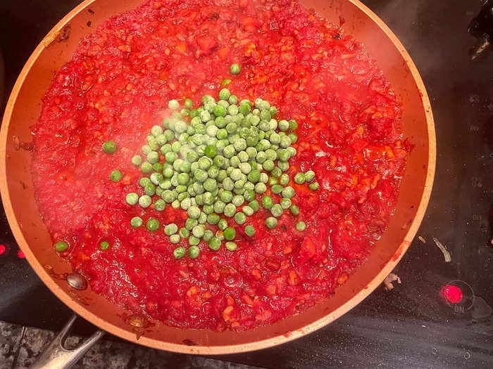 Once my timer hit 15 minutes, I added frozen peas to my ragu.