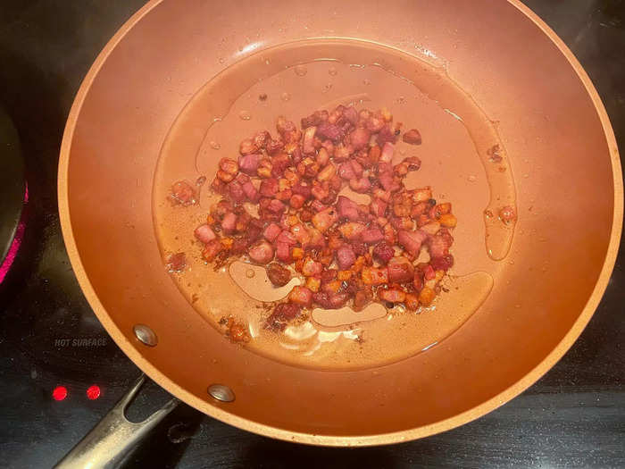 Then I threw my diced pancetta into a pan over medium heat.