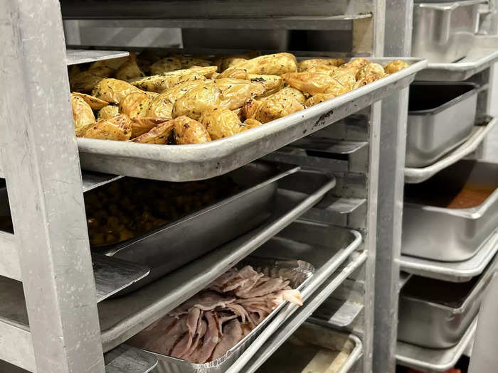 The Dulles kitchen alone chops 500 pounds of potatoes, 400 pounds of carrots, and up to 1,000 pounds of chicken per day.