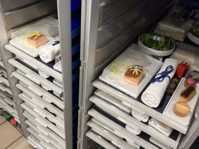 Once meals are fully cooked, they are put in containers and prepped for passengers. Gate Gourmet provides all the plates and equipment needed for the meals, including washing them between flights.