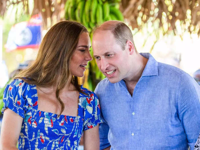 The couple whispered to each other while visiting a cacao farm.