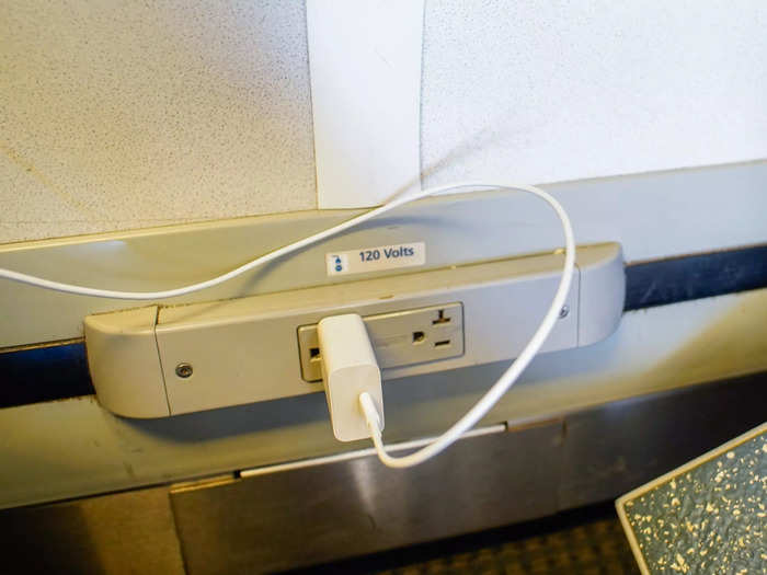 Next to my feet, there were two outlets to charge my devices, which I appreciated since I wasn