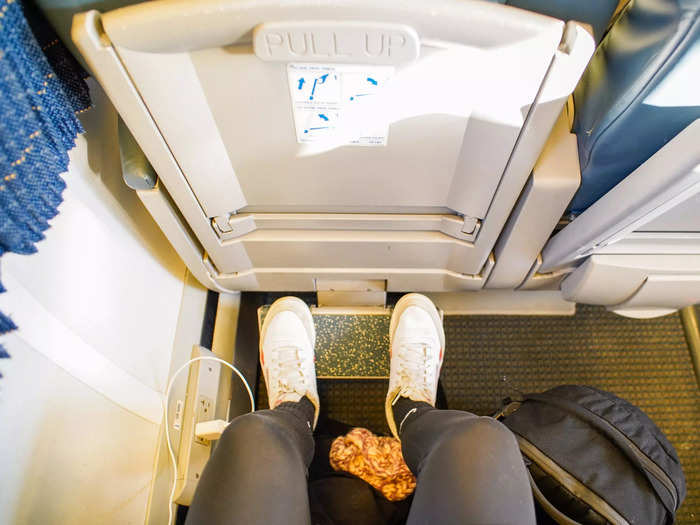 But I had adequate legroom. Below me, a footrest pulled out from the seat-back chair.