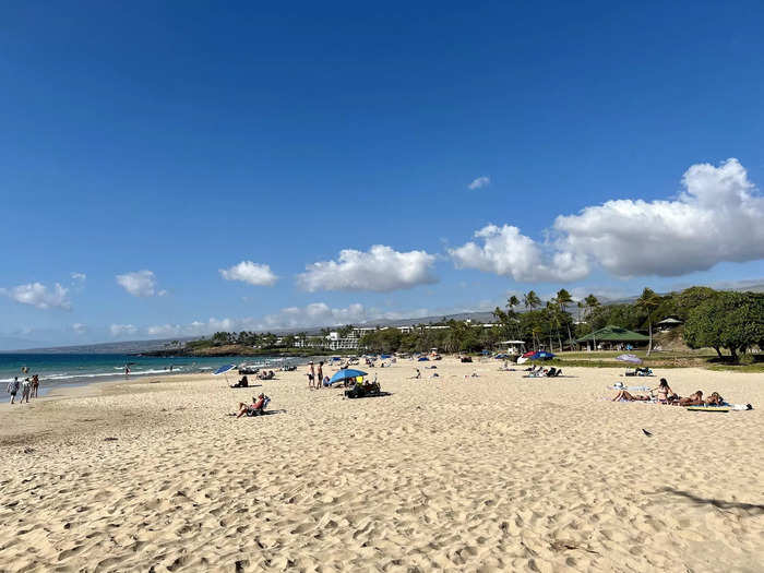 There was a diverse crowd of beachgoers doing a range of different activities.