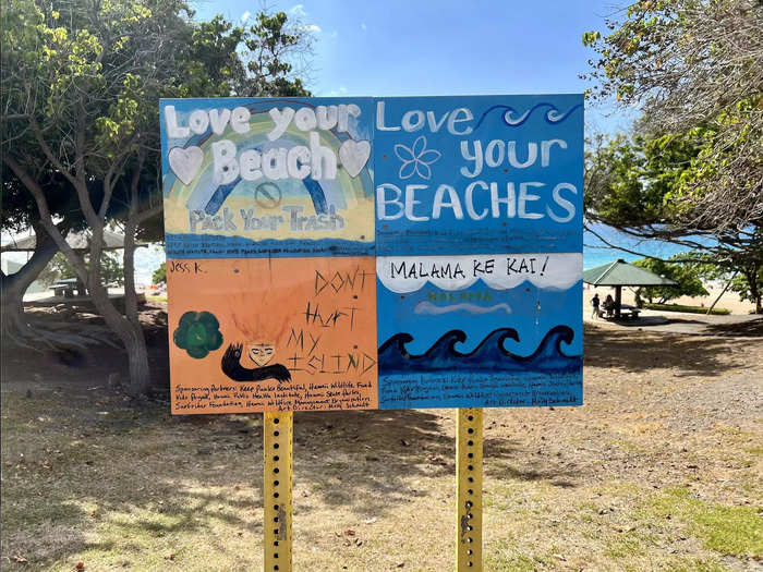 Another sign posted along the walkway down to the sand reminded beachgoers to respect and care for the land.