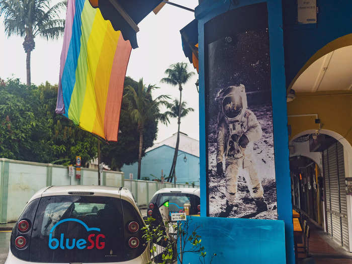 Right outside the hostel was a rainbow flag and a row of electric cars.