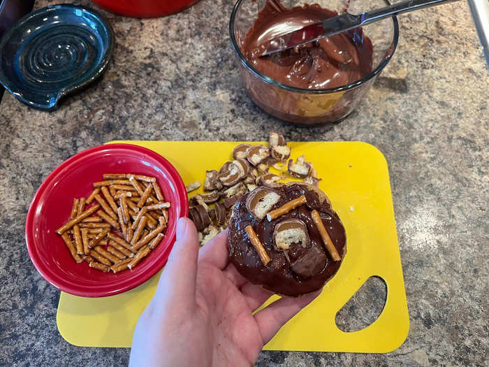 For the last step, I quickly added the pretzels and the Twix pieces to the chocolate before it dried.