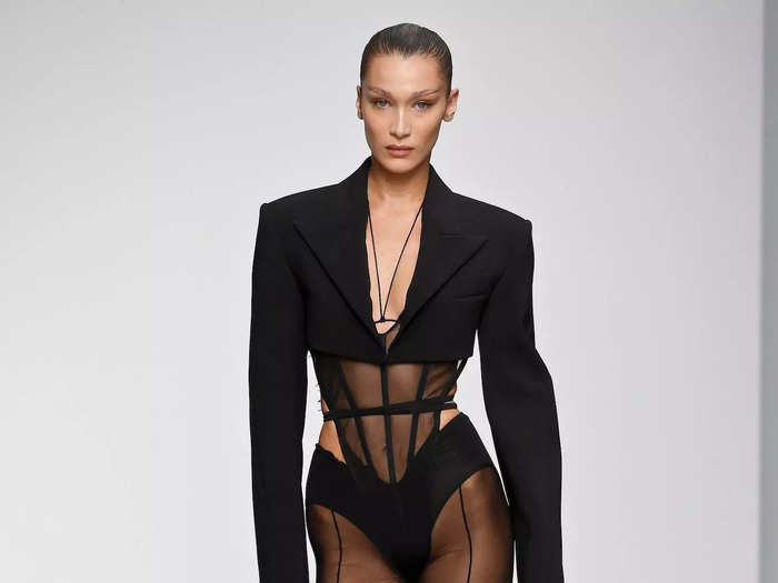 During a Mugler show in September 2019, Hadid strutted the runway wearing a see-through, form-fitting jumpsuit with an attached corset.