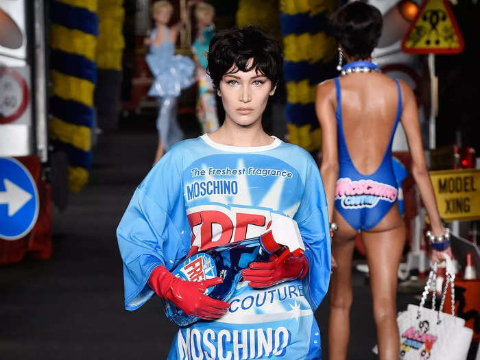 The model, who was 19 years old at the time, then wore a printed top, pleated skirt, and red-leather boots for a Moschino show the next day.