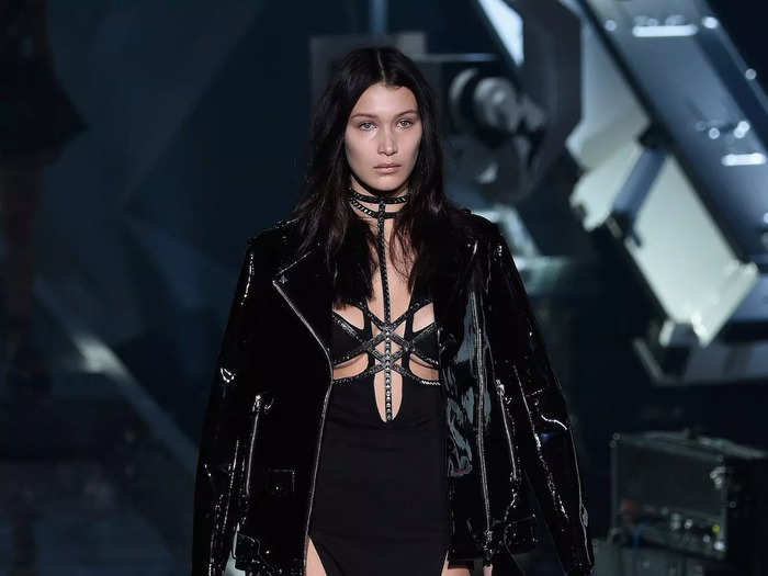 For one of her early runway appearances in September 2015, Bella Hadid wore a black Philipp Plein dress with bodice cutouts.