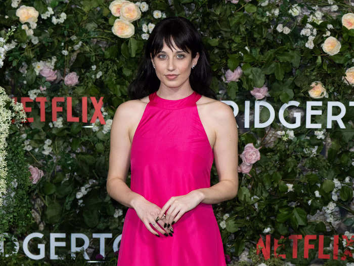 While Penelope Featherington actress Nicola Coughlan had to skip the premiere due to catching COVID-19, Harriet Cains who plays her sister Philippa was in attendance in a pink gown.