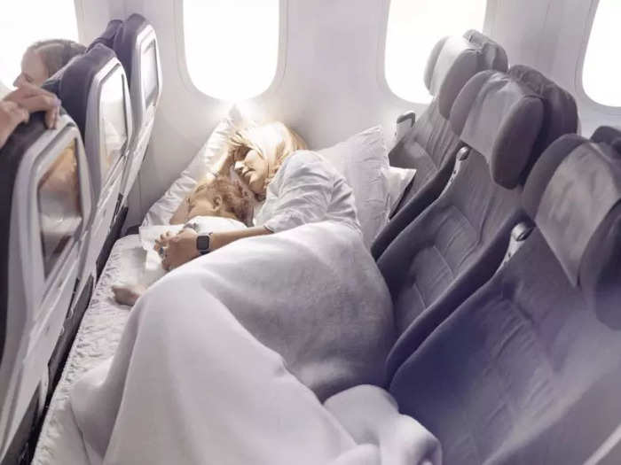 A skycouch is a row of three economy seats that convert into a private couch after take-off so passengers can more easily spread out, lie down, or sleep.