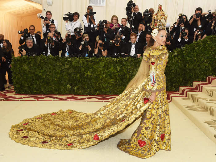 Parker was a real traffic-stopper at the 2018 Met Gala in this ornate golden dress with matching cape and headpiece.