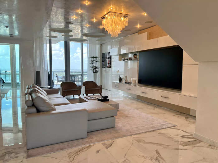 On the other side of the main floor, which features Calacatta Gold marble, is the living area. It