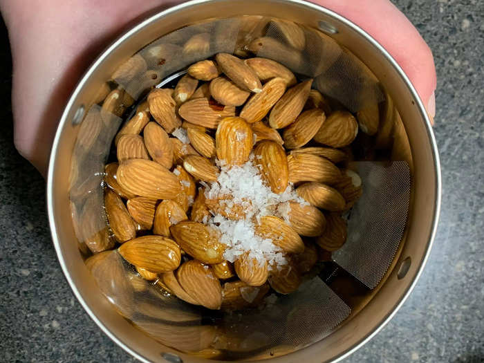 Then the almonds go into the filter cup along with some sea salt, and maple syrup for sweetener.