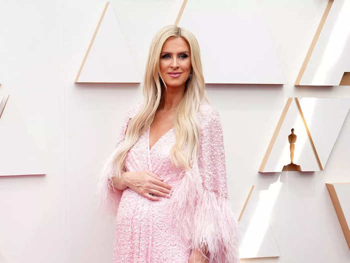 Nicky Rothschild showed off her baby bump in a pink Jenny Packham gown with feather trimmed sleeves.