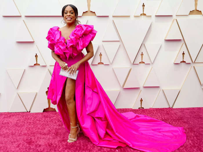 Niecy Nash opted for a hot-pink gown with ruffled sleeves and a daring, thigh-high slit.