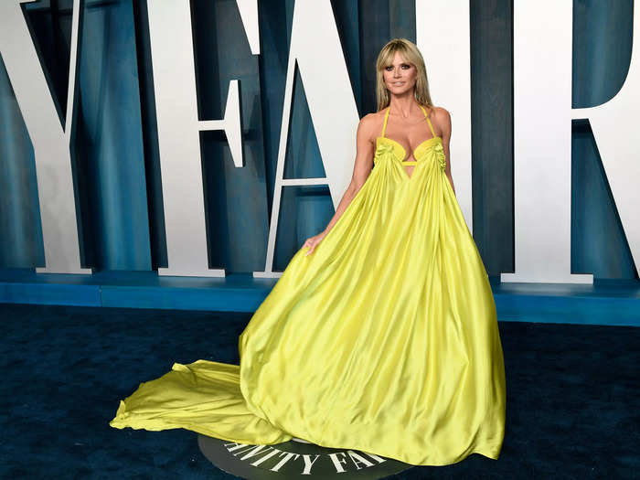 Heidi Klum stood out in a bright yellow gown which had a sweetheart neckline.