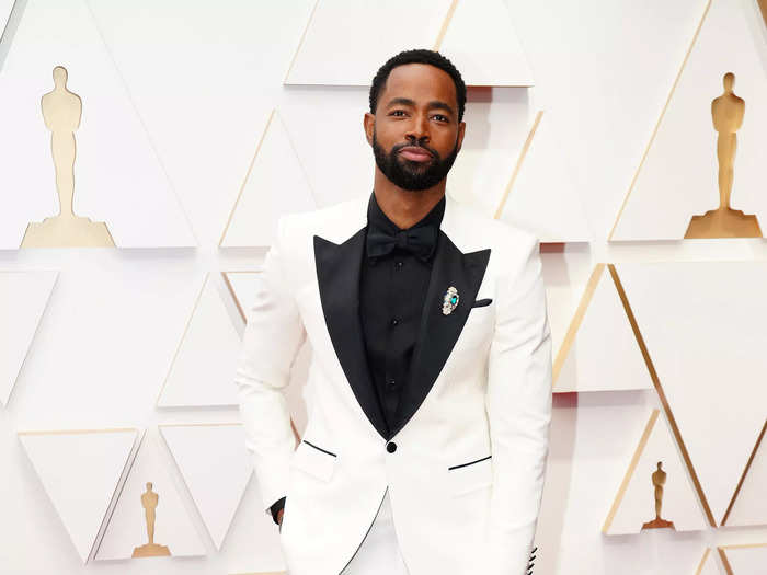 Jay Ellis looked suave in a white tuxedo with black accents, accessorized with a sparkling brooch.