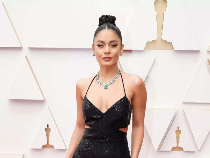 Keeping it simple, Vanessa Hudgens opted for a sparkly black maxi dress and let the jewelry do the talking.