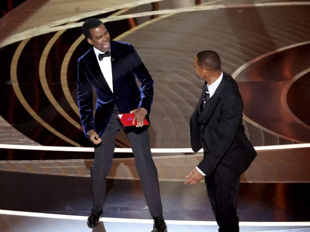 Chris Rock and Will Smith onstage at the 2022 Oscars