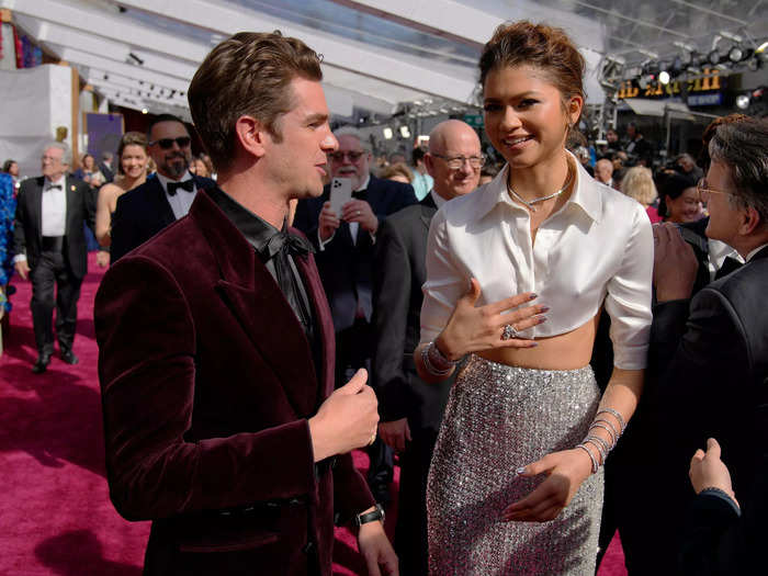 They briefly caught up while on the carpet.