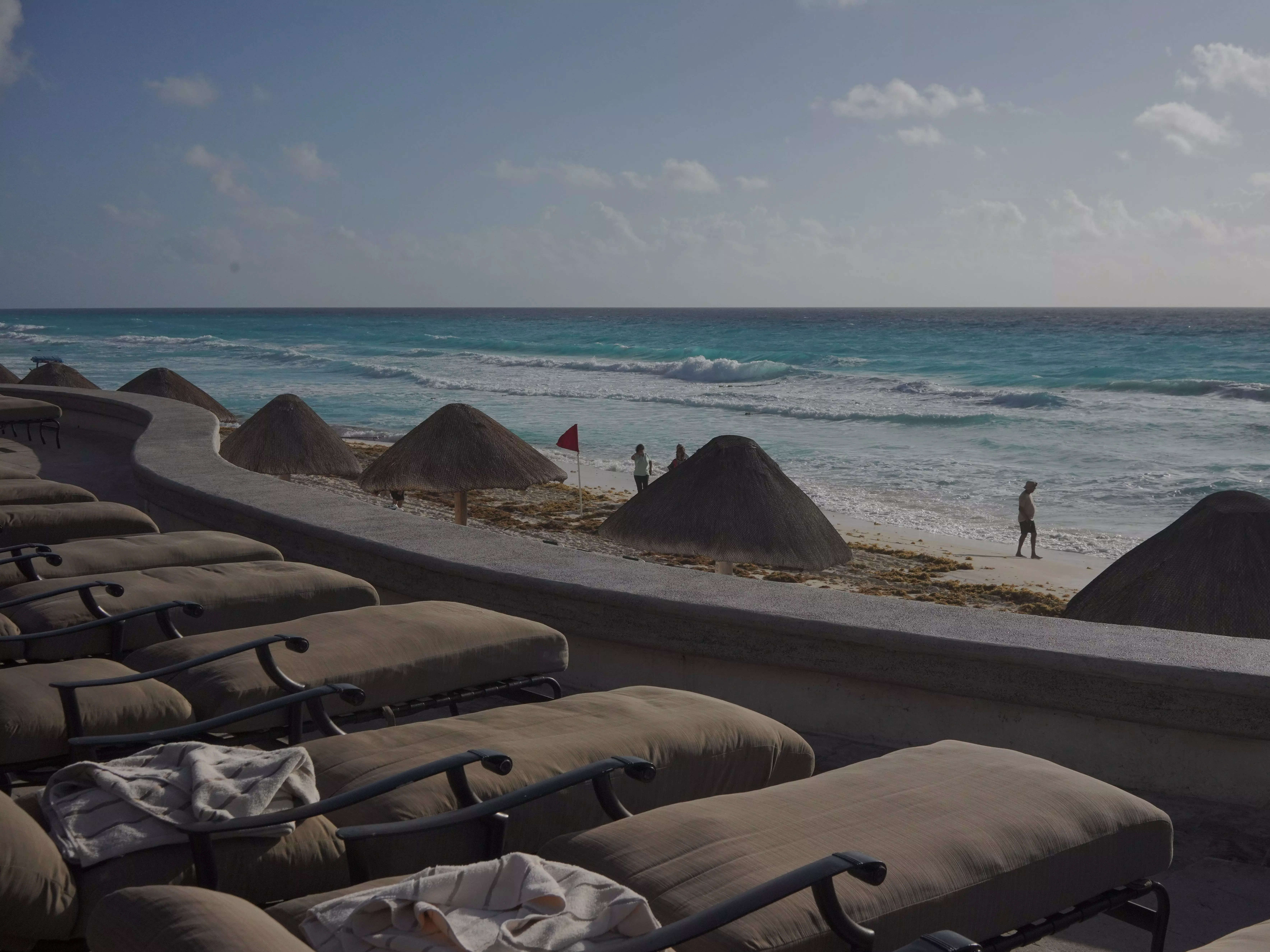 JW Marriott beaches with seating facing beach and sand dunes by water