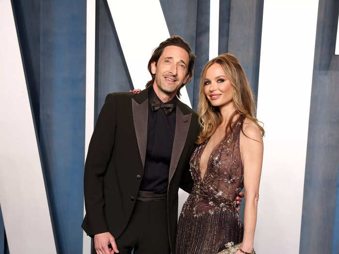 Adrien Brody and Georgina Chapman coordinated perfectly in earth-toned ensembles.