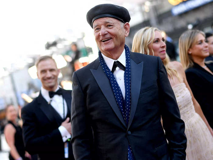 Bill Murray added a beret and scarf to his chic look.