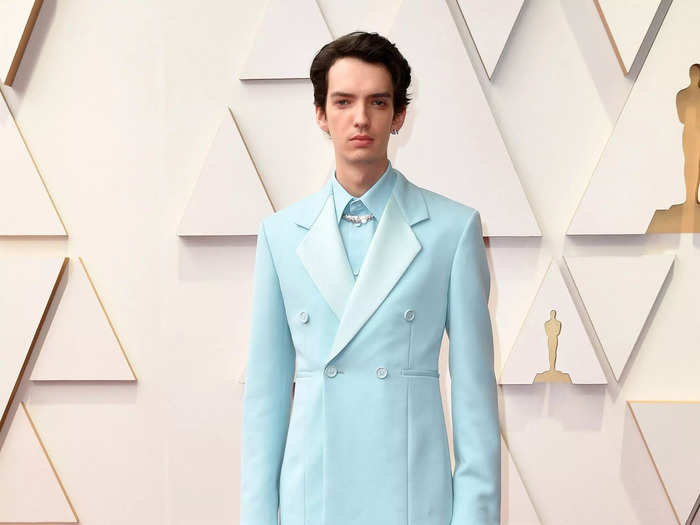 "The Power of the Dog" actor Kodi Smit-McPhee wore a serene monochromatic ensemble.