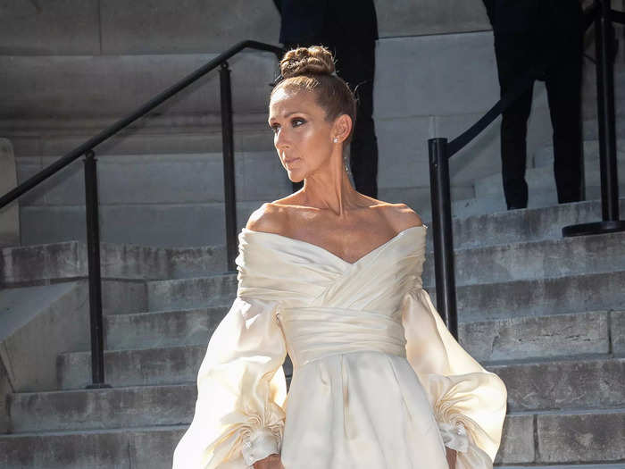 Ready for the runway, or a ballet, Dion looked pristine in cream the following day.