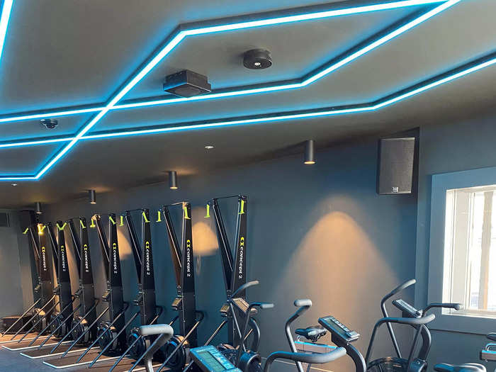 The second studio is for functional fitness classes, with assault bikes, ski ergs, and various free weights.