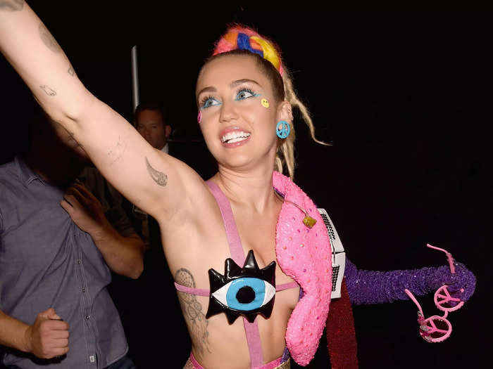 Miley Cyrus accidentally flashed when she was filmed changing into her final look backstage at the 2015 VMAS.