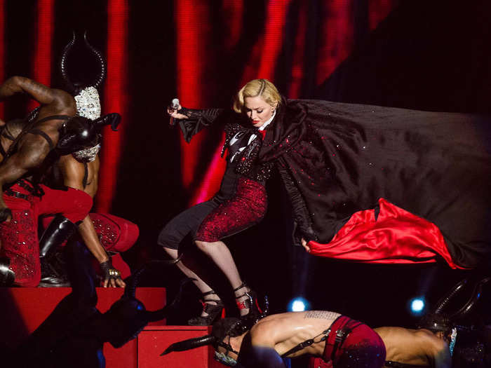 Madonna took a tumble when her heavy cape was tied too tightly around her neck at the 2015 Brits.