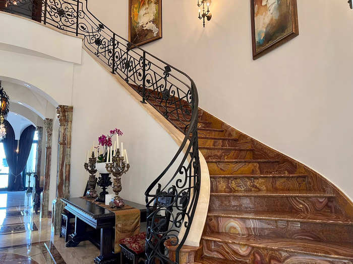 Inside, the 7,089 square-foot villa is filled with finishes from around the world. The grand sweeping staircase is made of onyx, making a statement as soon as you walk in.