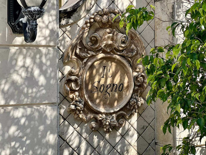 The entrance featured ornate details like a plaque boasting the name of the house.