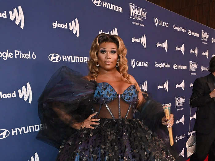 Drag queen Peppermint looked stunning in a blue and black ball gown.