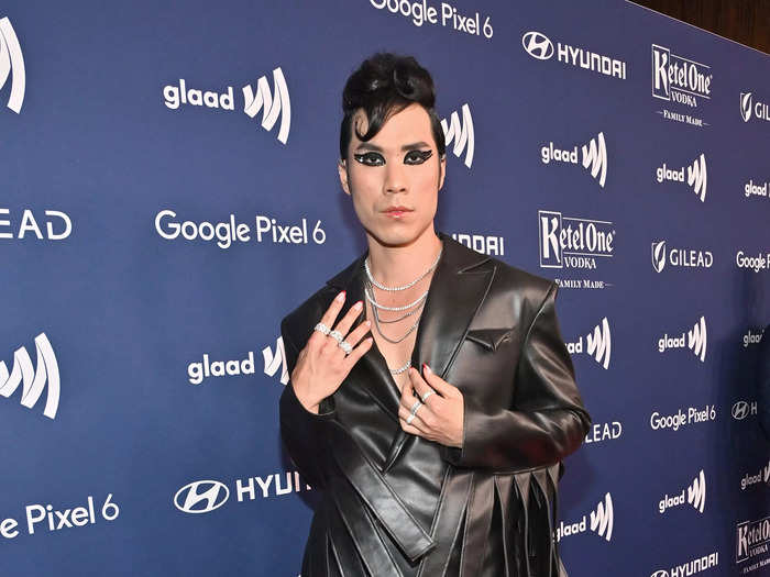 "Try Guys" member Eugene Lee Yang brought layers of leather to the GLAAD red carpet.