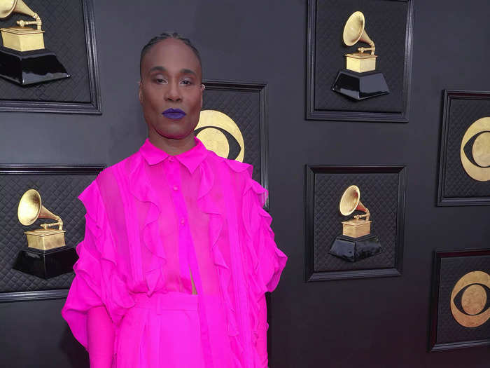 Billy Porter stunned in a bright pink ruffled ensemble by Valentino.