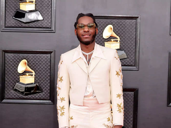 Leon Bridges rocked an embellished white suit and sunglasses.