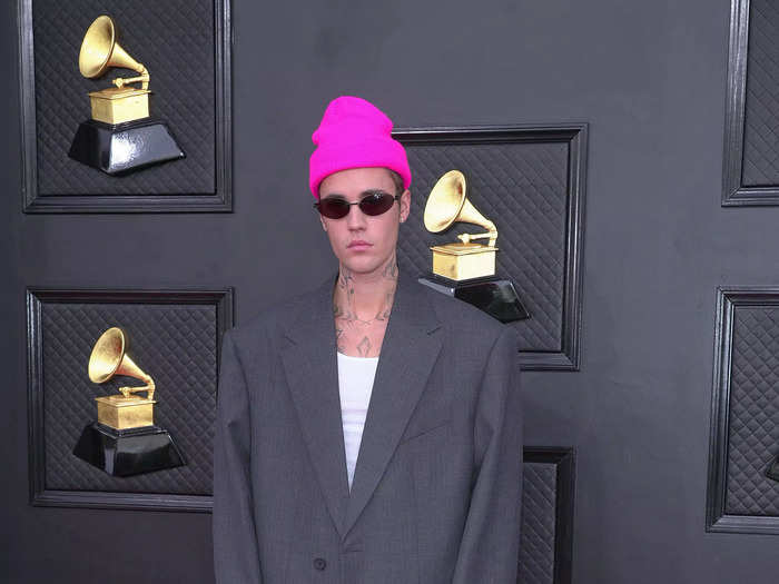 Justin Bieber sported an oversized grey suit by Balenciaga and a neon-pink beanie.