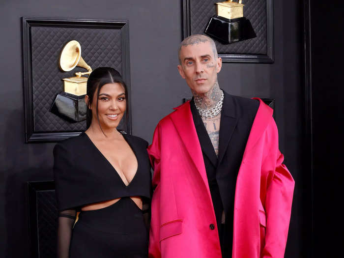 Kourtney Kardashian and Travis Barker arrived in chic black looks.