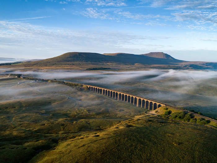 The Ribblehead Viaduct in the Yorkshire Dales, England, is a great place to watch the sunrise.