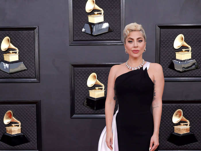 Lady Gaga attended the 2022 Grammys in a one-shoulder black-and-white gown.